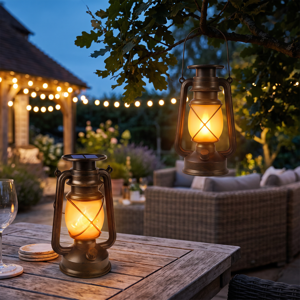 Both lanterns from the 2 pack glowing on a patio