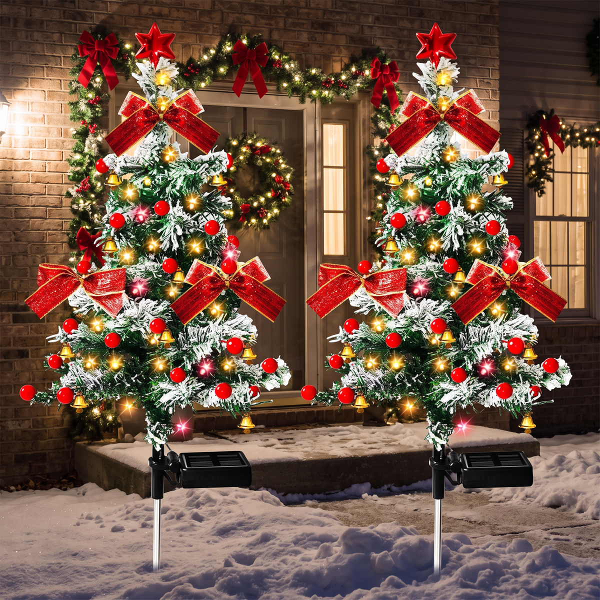 Cedar tree solar lights by a snowy porch at night