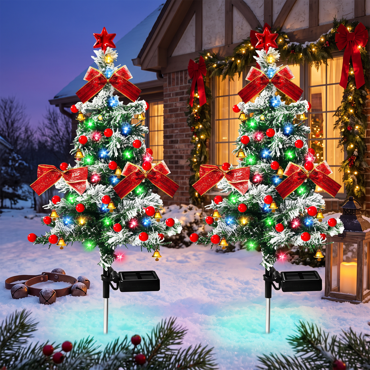 Both cedar tree lights glowing in snow