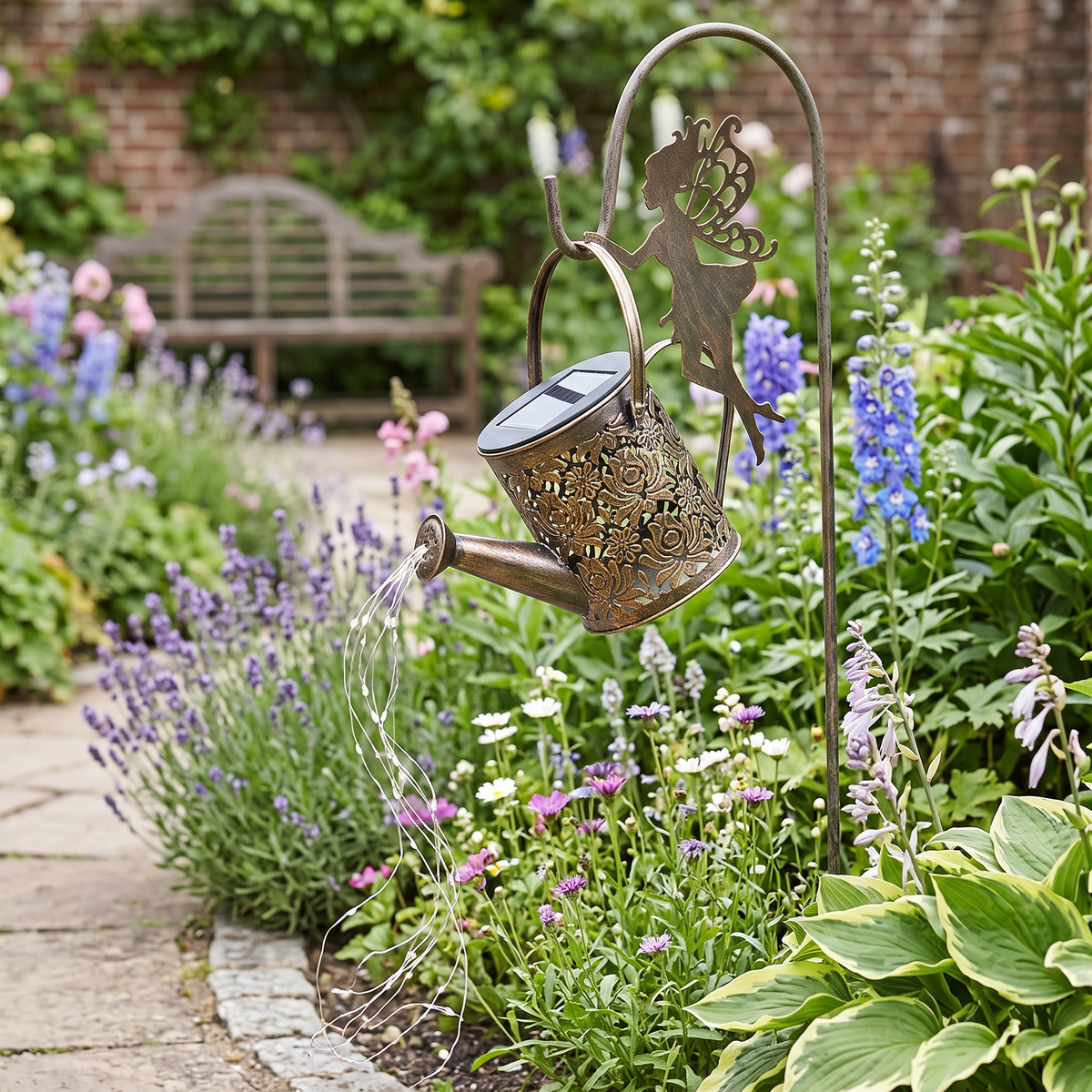 Watering can light hanging in a garden in daylight