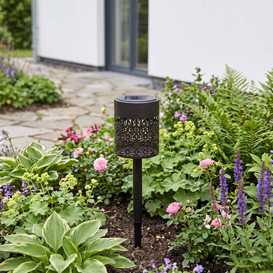 Peony mandala solar light in a flower bed in daylight