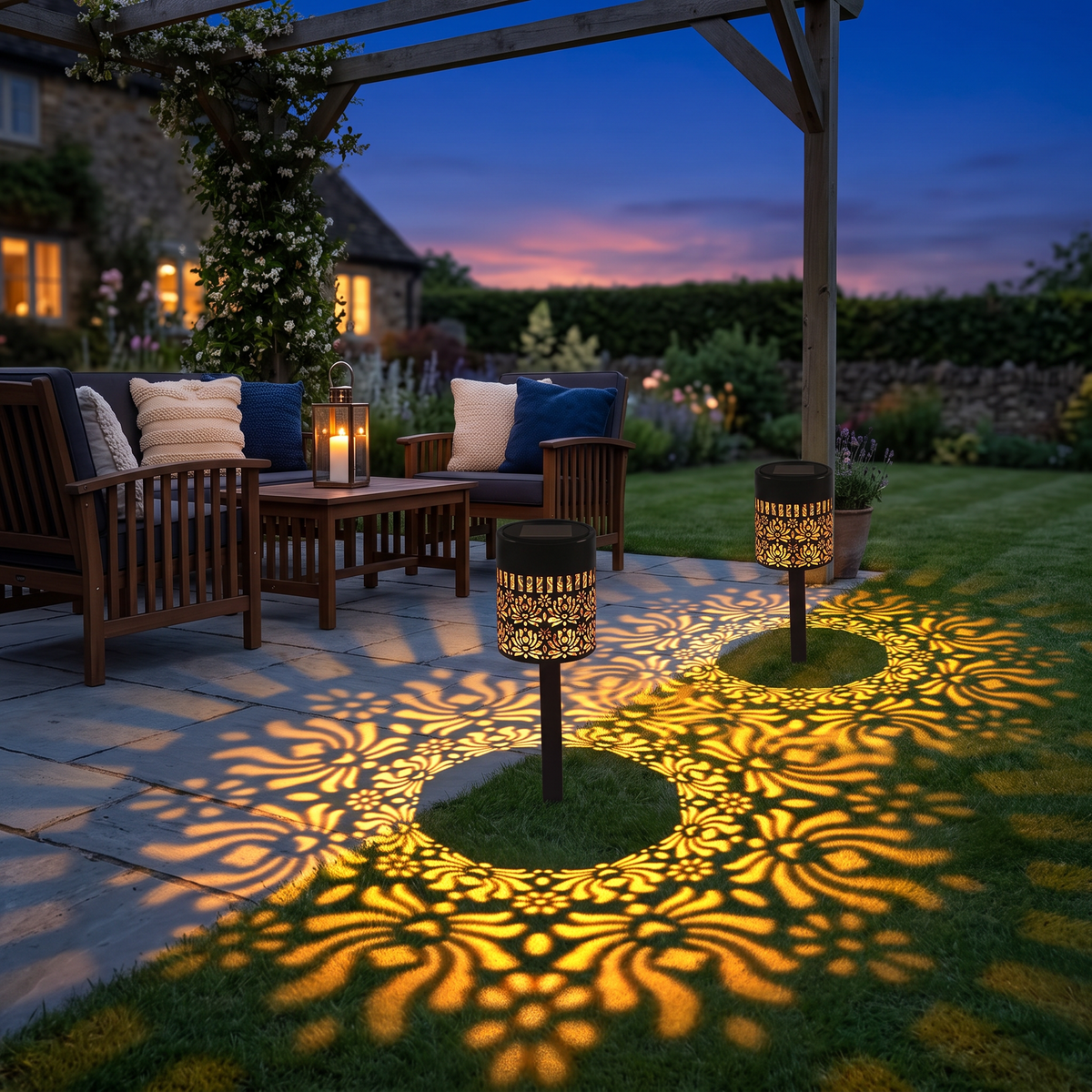 Both peony mandala lights lining a patio edge